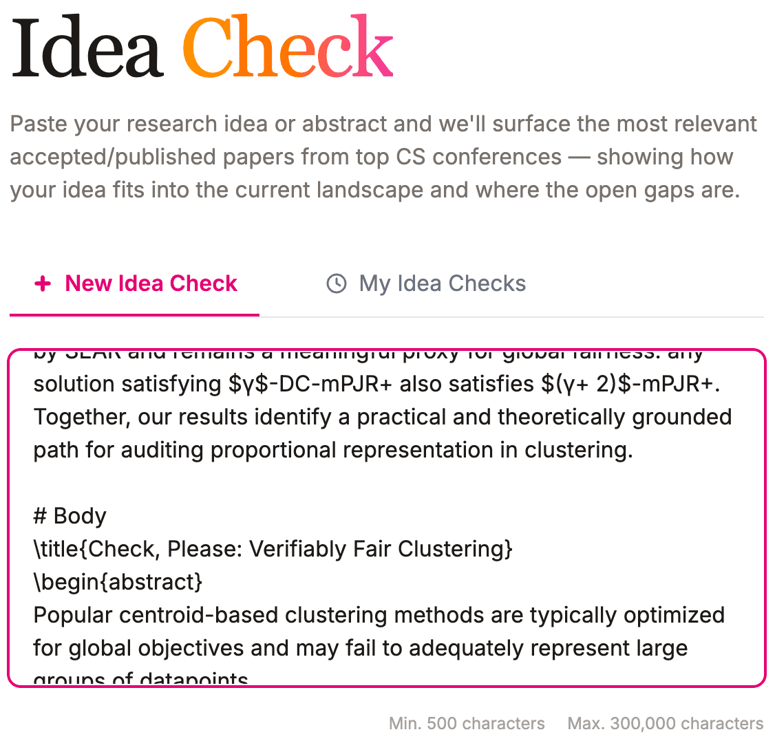 The Idea Check page with a research abstract pasted into the input box, showing the 500 to 300,000 character limits